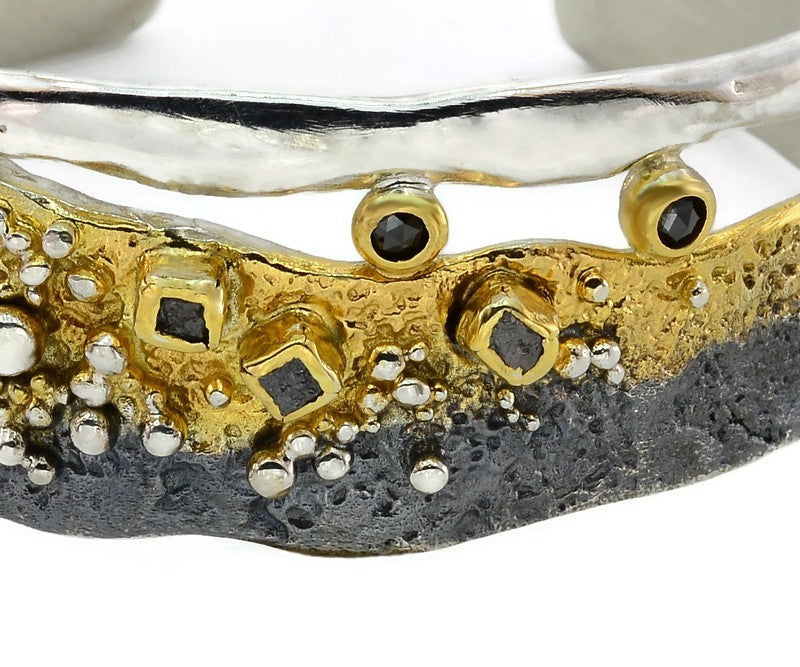 Silberarmband mit weißen und schwarzen Diamanten