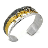 Silberarmband mit weißen und schwarzen Diamanten