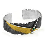 Armband aus vergoldetem, oxidiertem Silber mit Smaragd