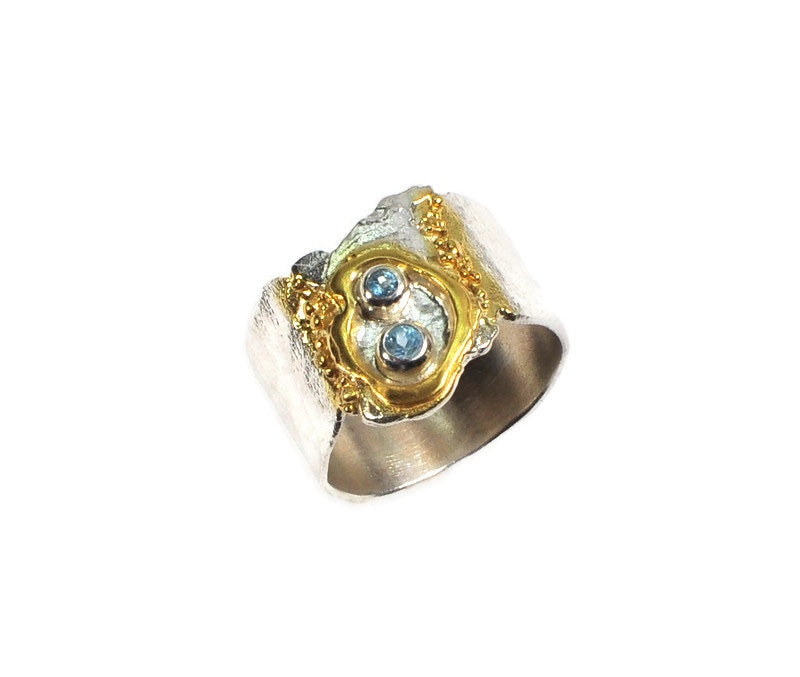 Ring aus Sterlingsilber mit zwei Schweizer Topas-Steinen